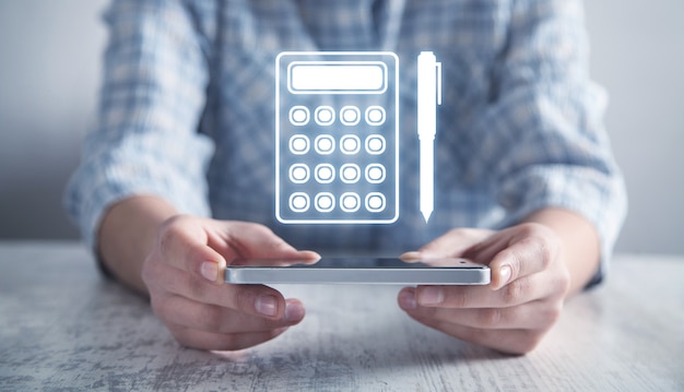 Business girl holding pen and calculator icon.