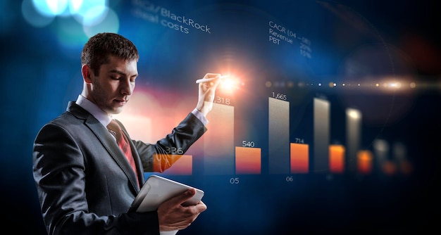 Business graph and trade monitor. Mixed media