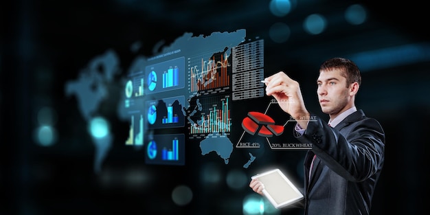 Business graph and trade monitor. Mixed media