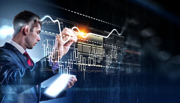 Business graph and trade monitor. Mixed media