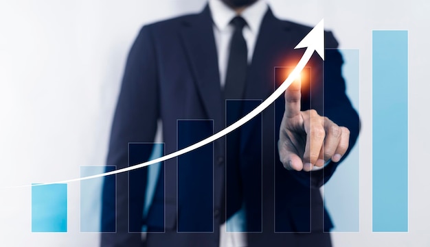 Business growth people Businessman pointing arrow graph on chart Business corporate growth plan and business development to success and growing growth concept