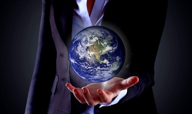 Business hand holding globe