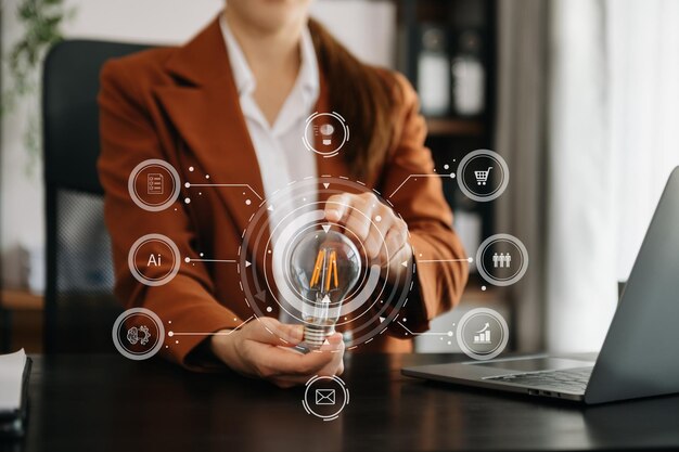 business hand showing creative business strategy with light bulb as concept