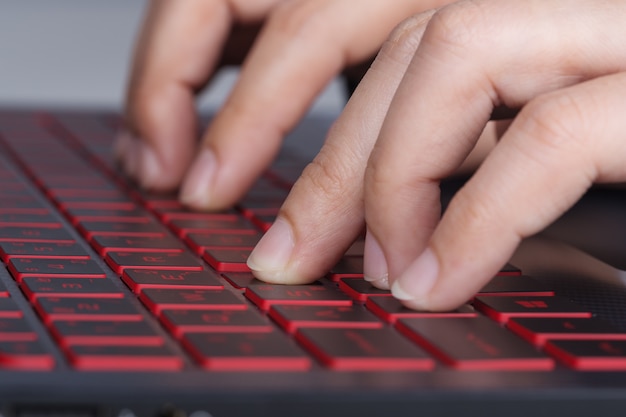 business hand typing keyboard of laptop