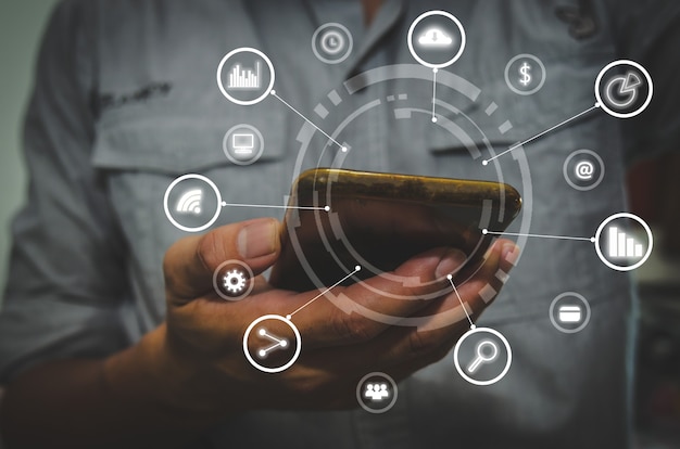 business hand using smartphone with icons concept