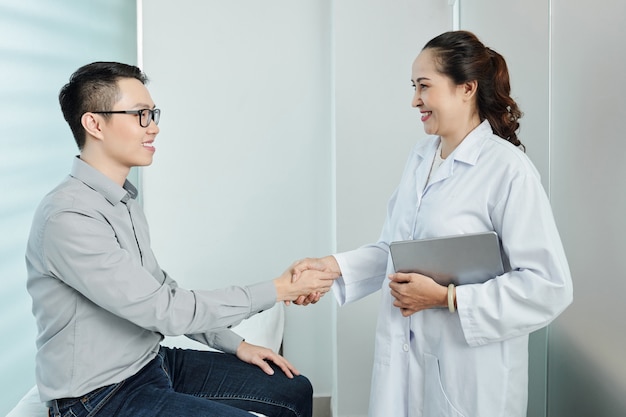 Business handshake at doctor's office