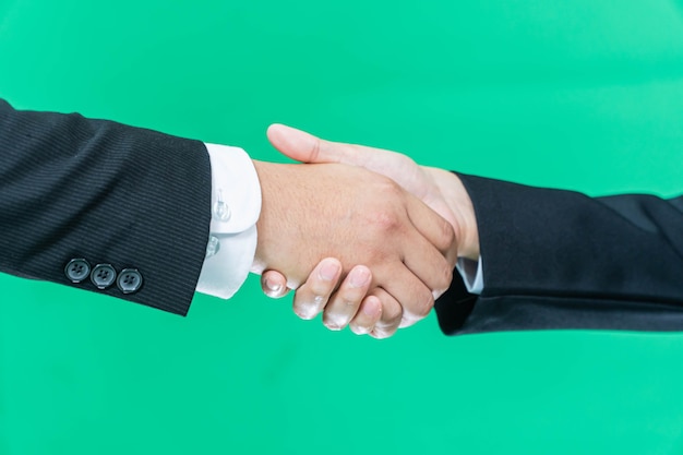 Business handshake on green screen background, partnership trust, respect sign