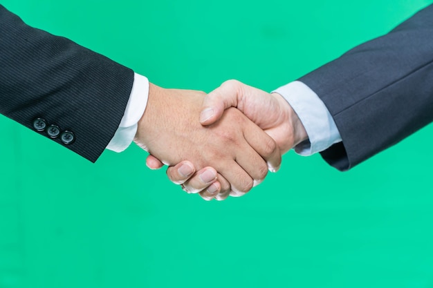 Business handshake on green screen background, partnership trust, respect sign