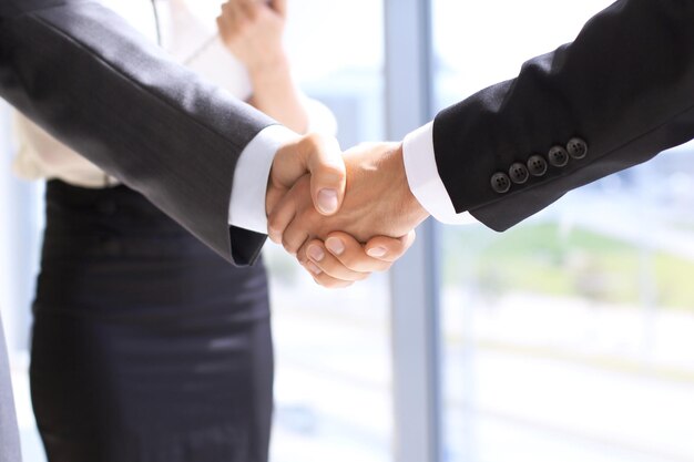 Business handshake in office. Success communication concept