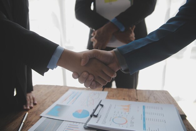 Business handshake for teamwork of business merger and acquisitionsuccessful negotiatehand shaketwo businessman shake hand with partner to celebration partnership and business deal concept