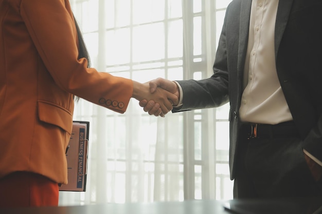 Business handshake for teamwork of business merger and acquisitionsuccessful negotiatehand shaketwo businessman shake hand with partner to celebration partnership and business deal concept