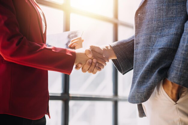 Photo business handshake for teamwork of business merger and acquisitionsuccessful negotiatehand shaketwo businessman shake hand with partner to celebration partnership and business deal concept