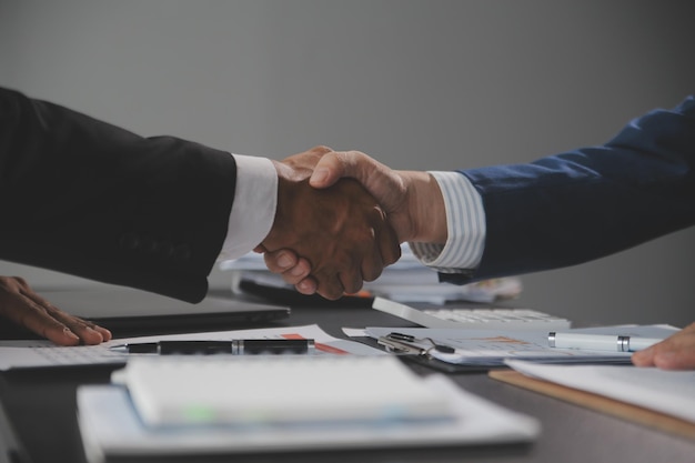 Business handshake for teamwork of business merger and acquisitionsuccessful negotiatehand shaketwo businessman shake hand with partner to celebration partnership and business deal concept