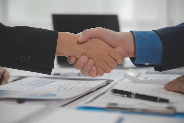 Business handshake for teamwork of business merger and acquisitionsuccessful negotiatehand shaketwo businessman shake hand with partner to celebration partnership and business deal concept