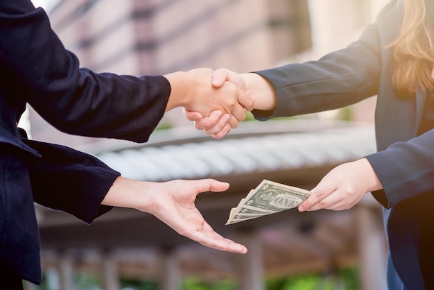 business handshake and teamwork for money and success goal