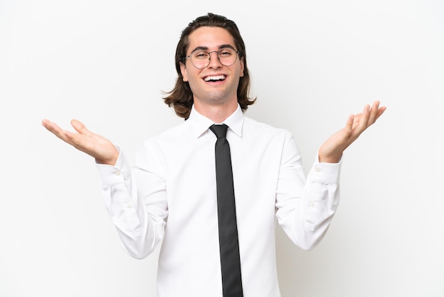 Business handsome man isolated on white background with shocked facial expression