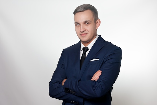 Business, health, people, and lifestyle concept - Portrait of handsome man in black blue suit. close up portrait of young happy smiling cheerful young man