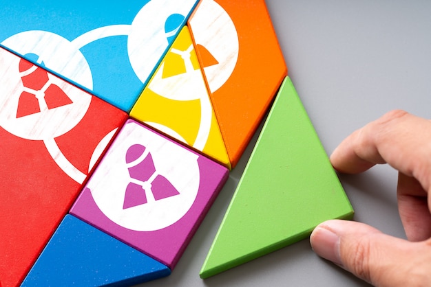 Business and HR human resource management icon on colorful puzzle