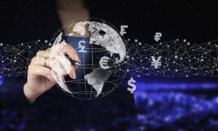 Photo business ideas, currency exchange, and global stock market analysis. hand holding digital graphic pen and drawing digital hologram virtual currency, financial sign on city dark blurred background.