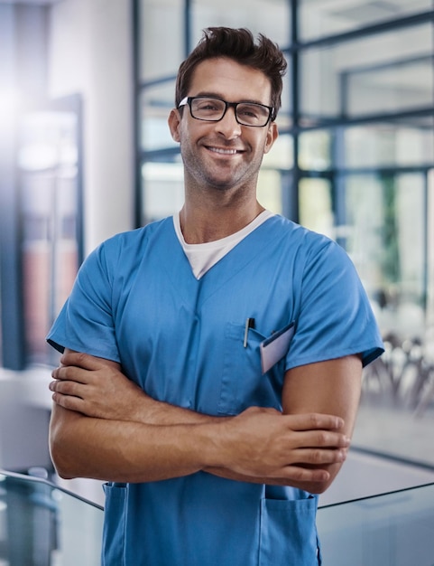 In the business of improving your health Portrait of a young handsome male medical practitioner working in a hospital