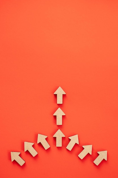 Photo business investment growth concept wooden arrows on red background