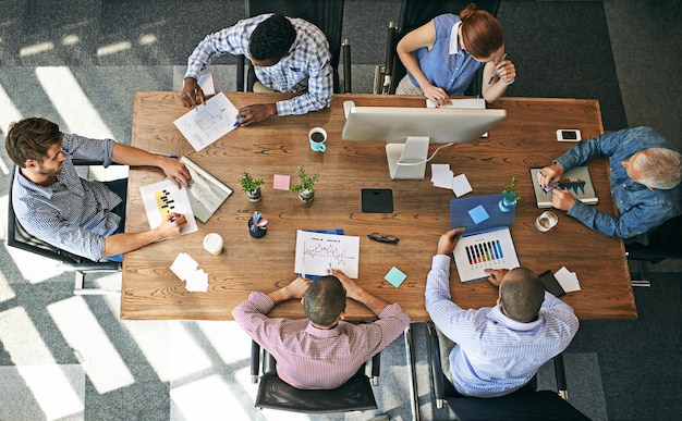 Business is looking good. Shot of a group of people working in an office.