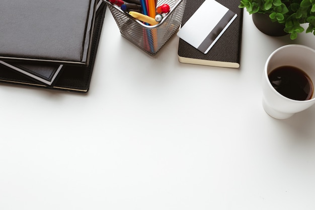 Business Items dropped in creative Disorder on white Table