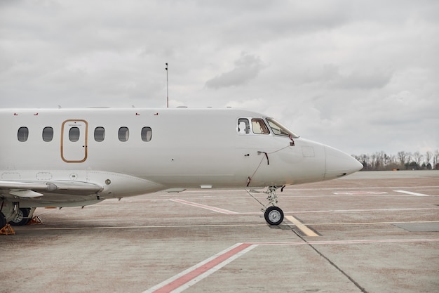 Business jet is standing on airport parking