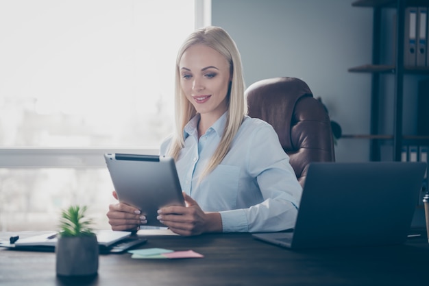 business lady read corporate report tablet