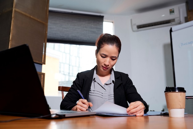 Business lady signing documents