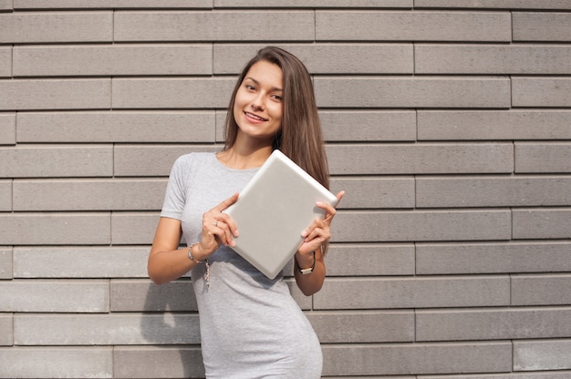 The business lady on the street is engaged in office work