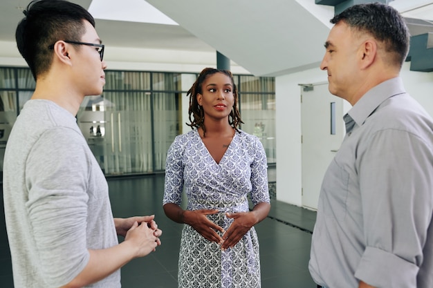 Business lady talking to coworkers