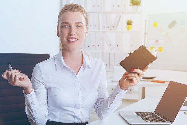 Business lady with notebook and pen