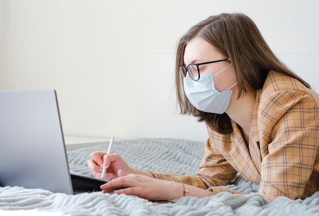 Business lady working at home on her laptop