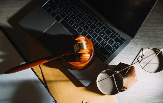 Business and lawyers discussing contract papers with brass
scale on desk in office law legal services advice justice and law
concept picture with film grain effect