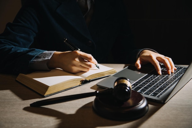 Business and lawyers discussing contract papers with brass\
scale on desk in office law legal services advice justice and law\
concept picture with film grain effect