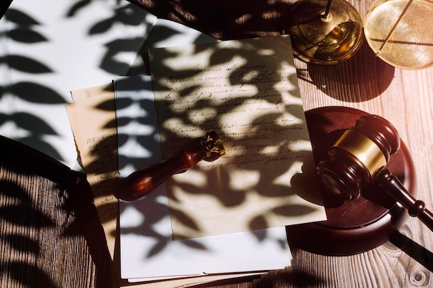 Business and lawyers discussing contract papers with brass scale on desk in office Law legal services advice justice and law concept picture with film grain effect