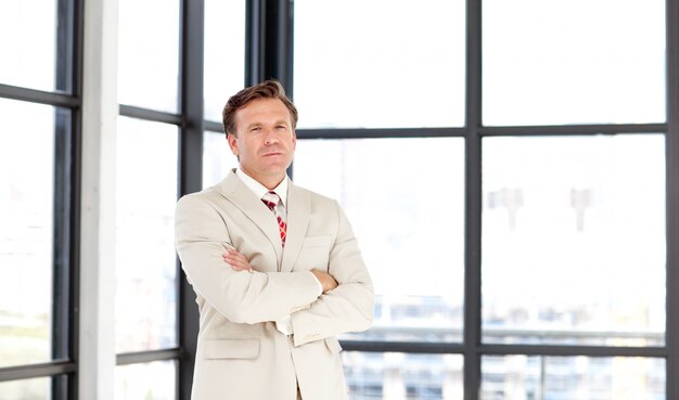 Business leader with folded arms looking at the camera