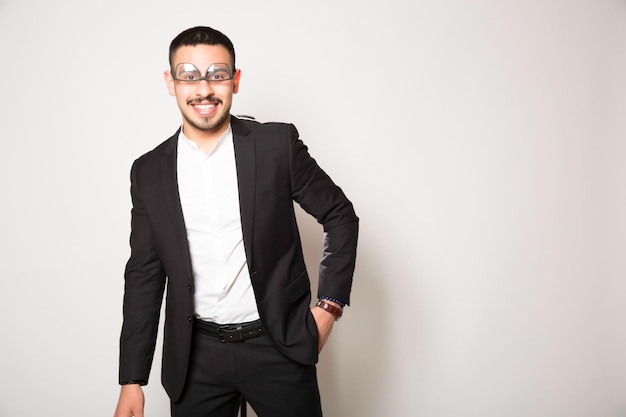 Business man in black tuxedo on white background