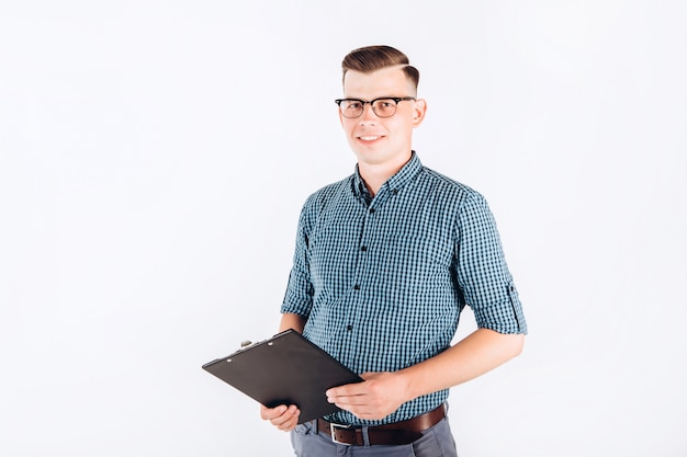 Business man in a blue shirt with a folder in hand