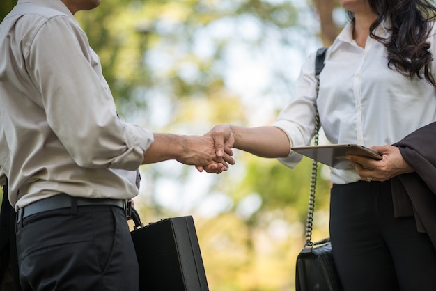 Business man and business women shake hand 