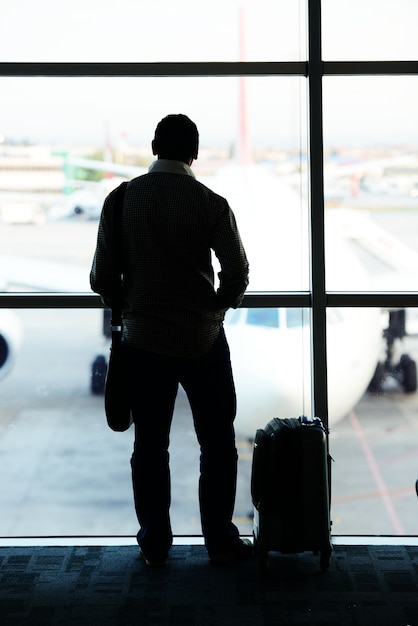 business man carrying a luggage at the airport