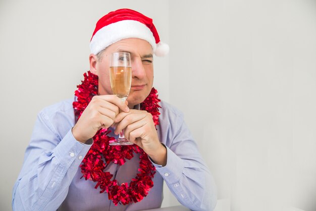 Business Man Celebrate Merry Christmas And Happy New Year Wear Santa Hat. Handsome businessman celebrating christmas in office