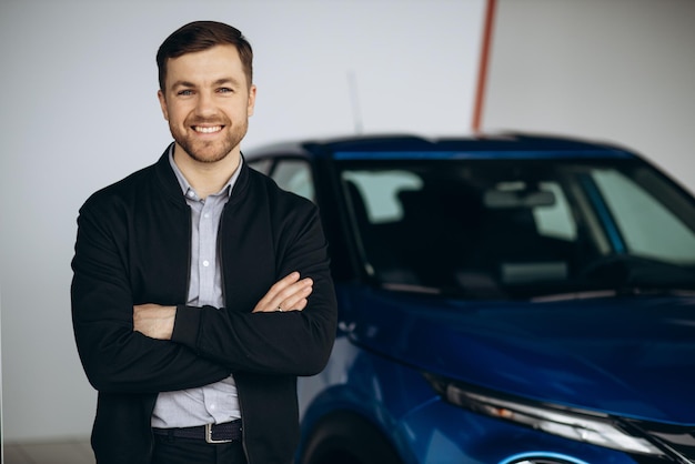 Business man choosing a car in car salon