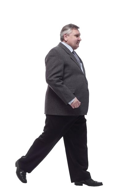 Business man confidently striding forward . isolated on a white