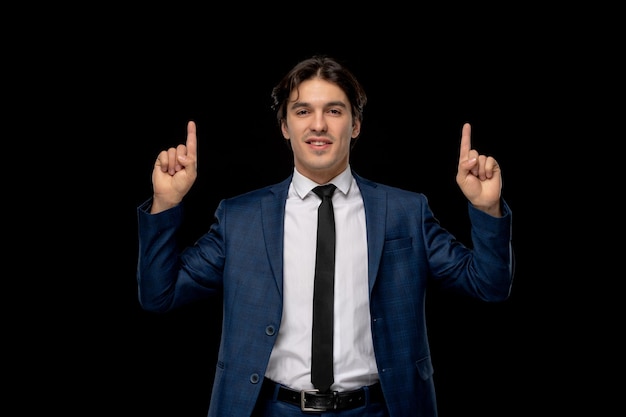 Business man cute lovely man in dark blue outfit with the tie pointing up