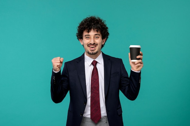 Business man cute pretty guy in black office outfit excited holding coffee cup