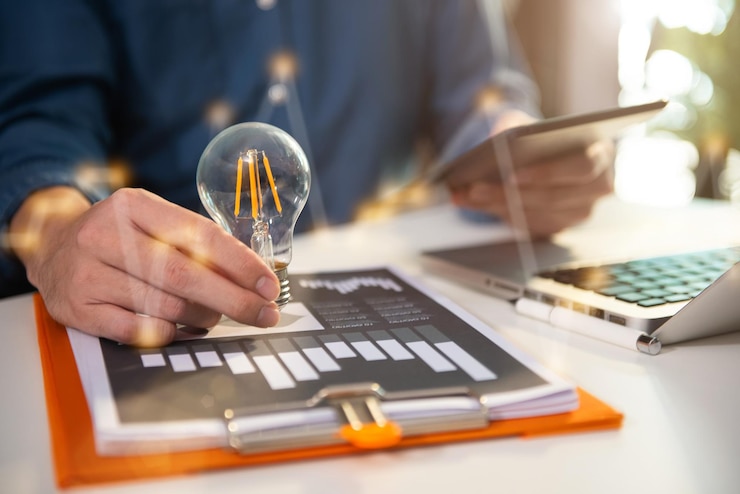 Photo business man entrepreneurs show creative business strategies with light bulbs