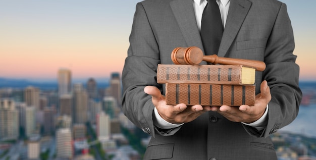 Business man in grey suit holding books