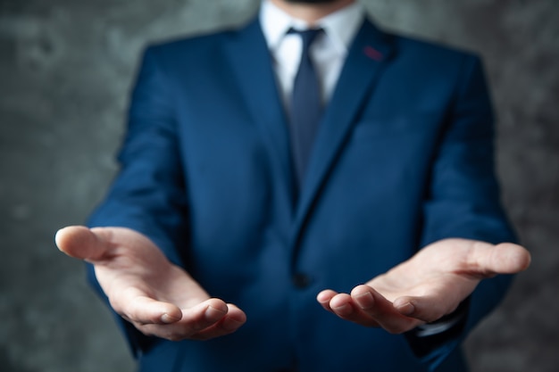 Business man hand empty palm in screen